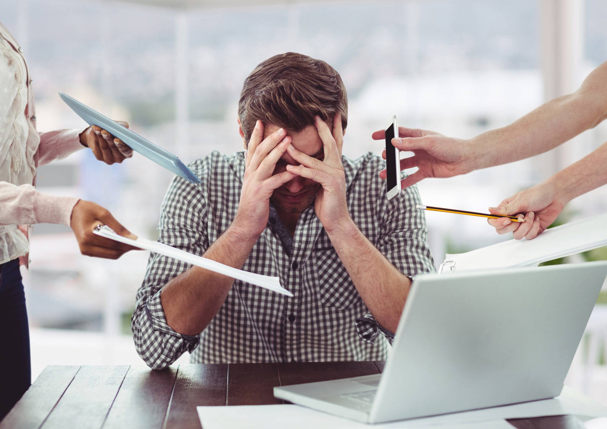Man holding head in hands - stressed